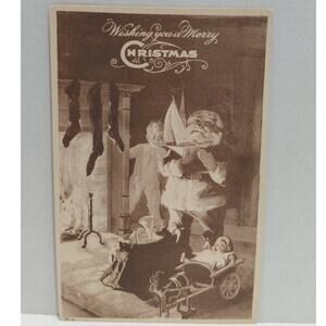 Antique Christmas Postcard Santa Claus Holding a Boat Unposted Divided